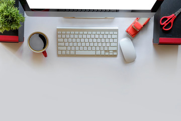 Workplace header image, Top view of Modern Desktop Computer on white desk in office.