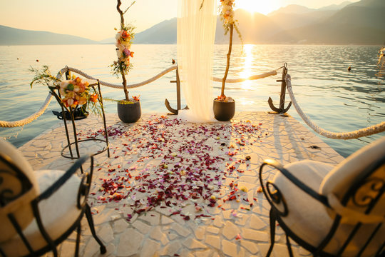 Rose petals on the floor. Wedding tradition of showering newlyweds with rose petals when they come out of the church.