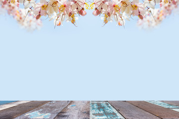 Fototapeta na wymiar empty wooden table with flower background for product montage display