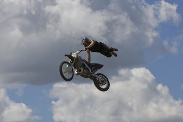 Fototapeta na wymiar Stunt Biker. Free stile performing