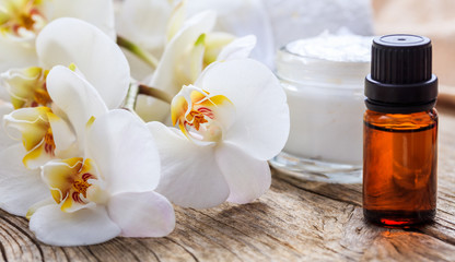 Fototapeta na wymiar Moisturizing cream and orchid - spa concept