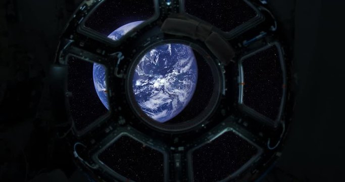 Spaceship window / Space travel / Planet Earth. Elements of this clip furnished by NASA. Porthole of rotating spacecraft with artificial gravity, leaving the planet Earth.