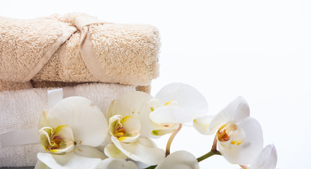 Naklejka na ściany i meble White orchid and towels on white background