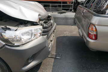 Car crash from car accident on the road in a city car pickup wait insurance.