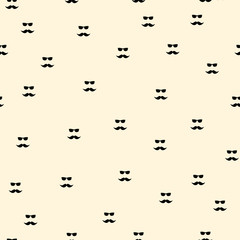 Vintage curly mustaches and glasses seamless pattern with black silhouettes of french stylized moustaches on yellow background. Great for textile print or barber shop interior design