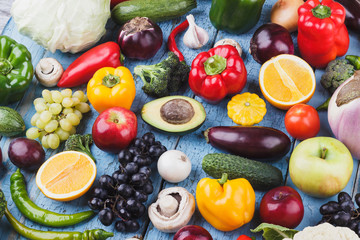 Set from different colorful vegetables and fruits on the wooden background