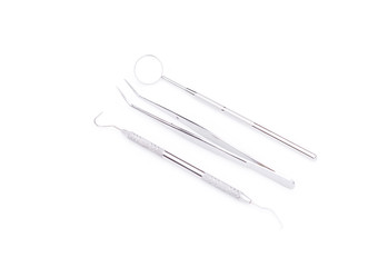 Dental tools and equipment on white background