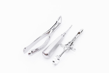 Dental tools and equipment on white background