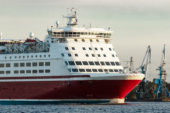 Red cruise liner's bow. Passenger ferry underway close up
