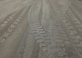 Obraz premium cement powder and wheel track on cement floor