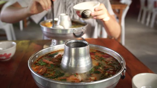 Tom Yum Goong, spicy Thai soup with shrimp in Thai hot pot