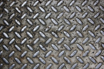 Diamond tread steel floor plate texture (dirty and worn)