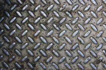 Diamond tread steel floor plate texture (dirty and worn)