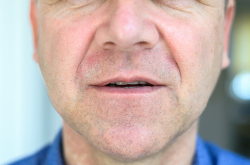 Lower face of a middle aged with lips ajar