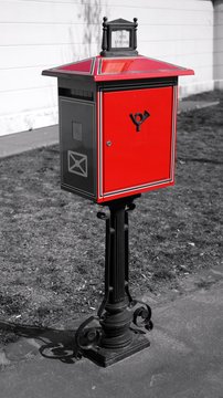 A typical red letter-box in Budapest on black and white background