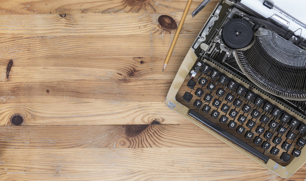 Old Polish typewriter on wooden desk