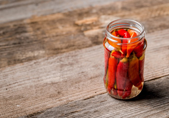 jar full of preserved pepper, copyspace left