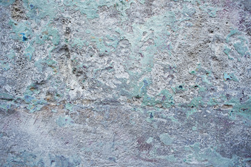 Blue wall from peeling paint. Texture cement
