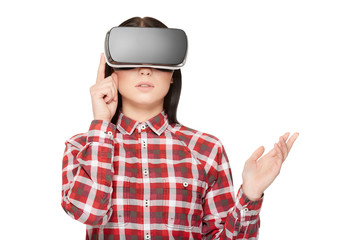 Girl in modern headset press buttons and watching video.