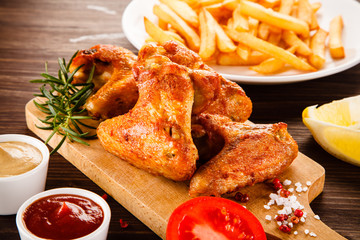 Roast chicken wings with french fries
