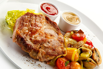 Roast steak on white plate