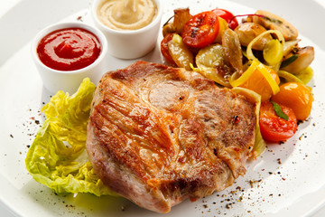 Roast steak on white plate