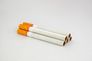 Tobacco cigarettes pile on white background