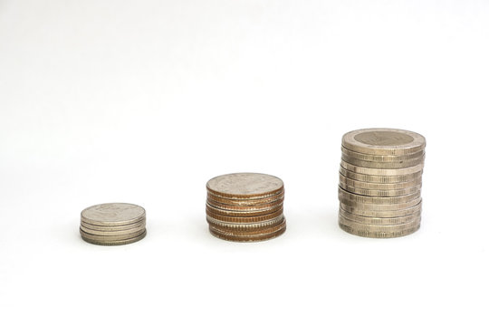 Stack coins growing or saving on white background