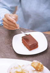 Woman eating chocolate cake