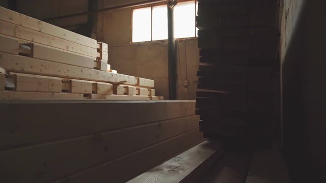 LVL Laminated Veneer Lumbe. Engineered stress-rated product created by bonding together individual pieces of lumber having a nominal thickness of 2 inches. Large hangar with the production line