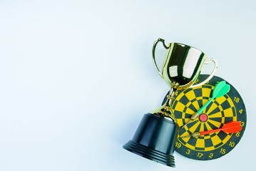 Golden trophy, Darts with crotch isolated on white background with copy space.Concept winner.