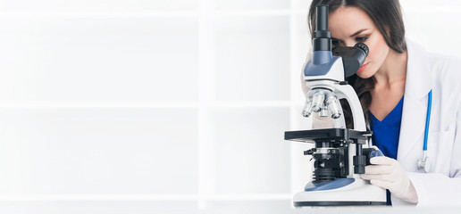 Female scientist with microscope