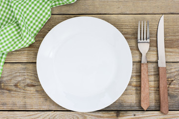 Empty Plate And Cutlery On The Wooden Table./Empty Plate And Cutlery On The Wooden Table 