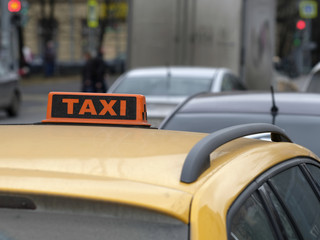 Taxi sign on a car roof