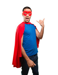 Happy superhero with call gesture