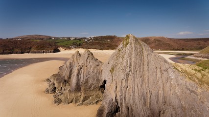 Dramatic Three Cliffs Bay on the Gower peninsula, Swansea, South Wales.