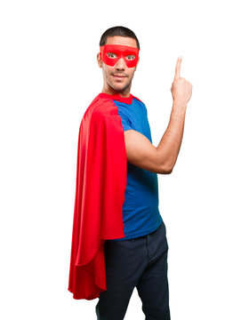 Winner superhero with number one gesture