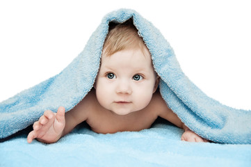Newborn child relaxing in bed after bath or shower. Clipping Path