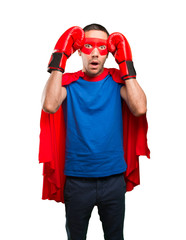 Surprised superhero with a boxing gloves
