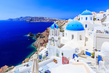 Santorini, Greece. Blue dome church on the village of Oia. - obrazy, fototapety, plakaty