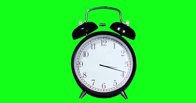 Time lapse of an alarm clock with green screen background. Professional shot in 4K resolution