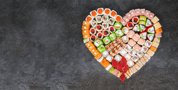 Sushi Net On A Black Surface. Flat Lay