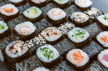 Sushi net on a black surface. Flat lay