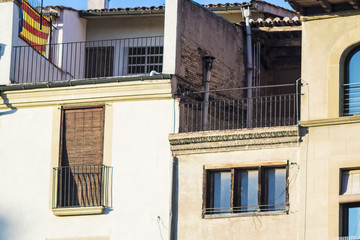 Fototapeta na wymiar Old roof terrace facade on a urban street cityscape
