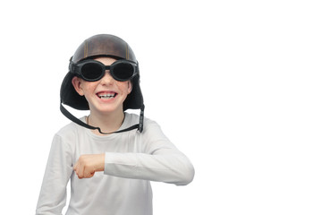 red-haired boy with freckles, motorcycle glasses and helmet