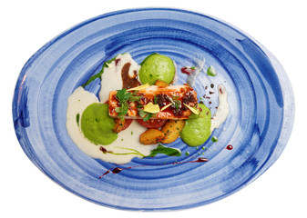 Chicken fillet on blue porcelain plate, isolated