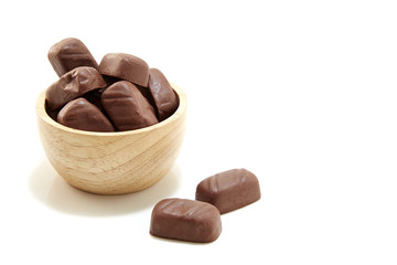 Chocolate candy in wooden bowl