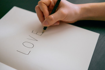 Love concept - Hand writing love on book