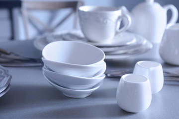 White dishes on grey table