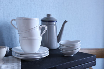 Different dishware on kitchen table